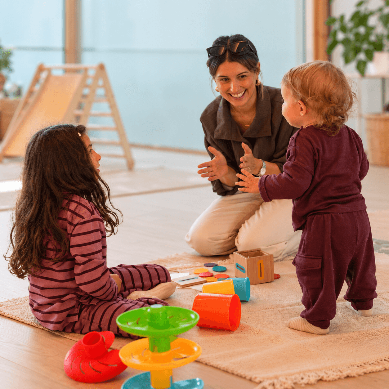 Speech & Language Therapist supporting young children during a play-based session
